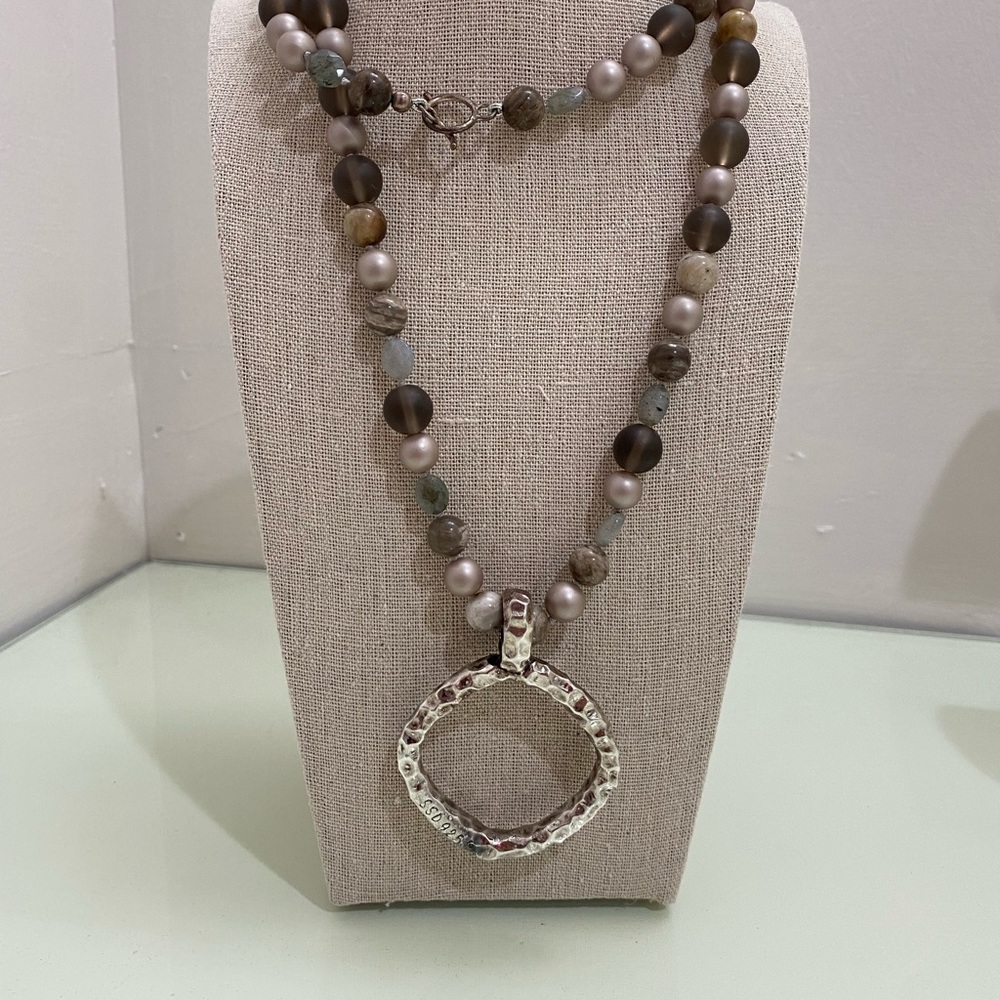 long necklace with silver pendant with earrings